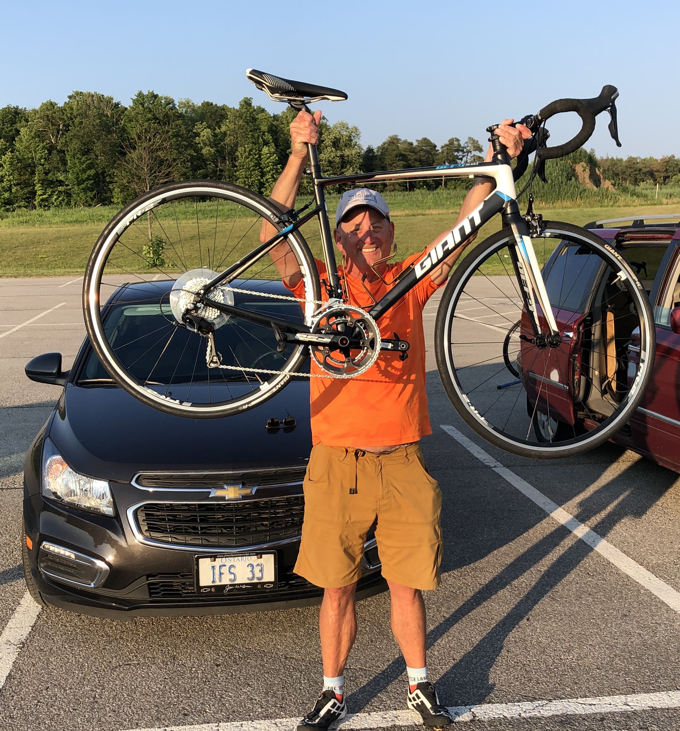 OrangeRoadCyclistAboveHead